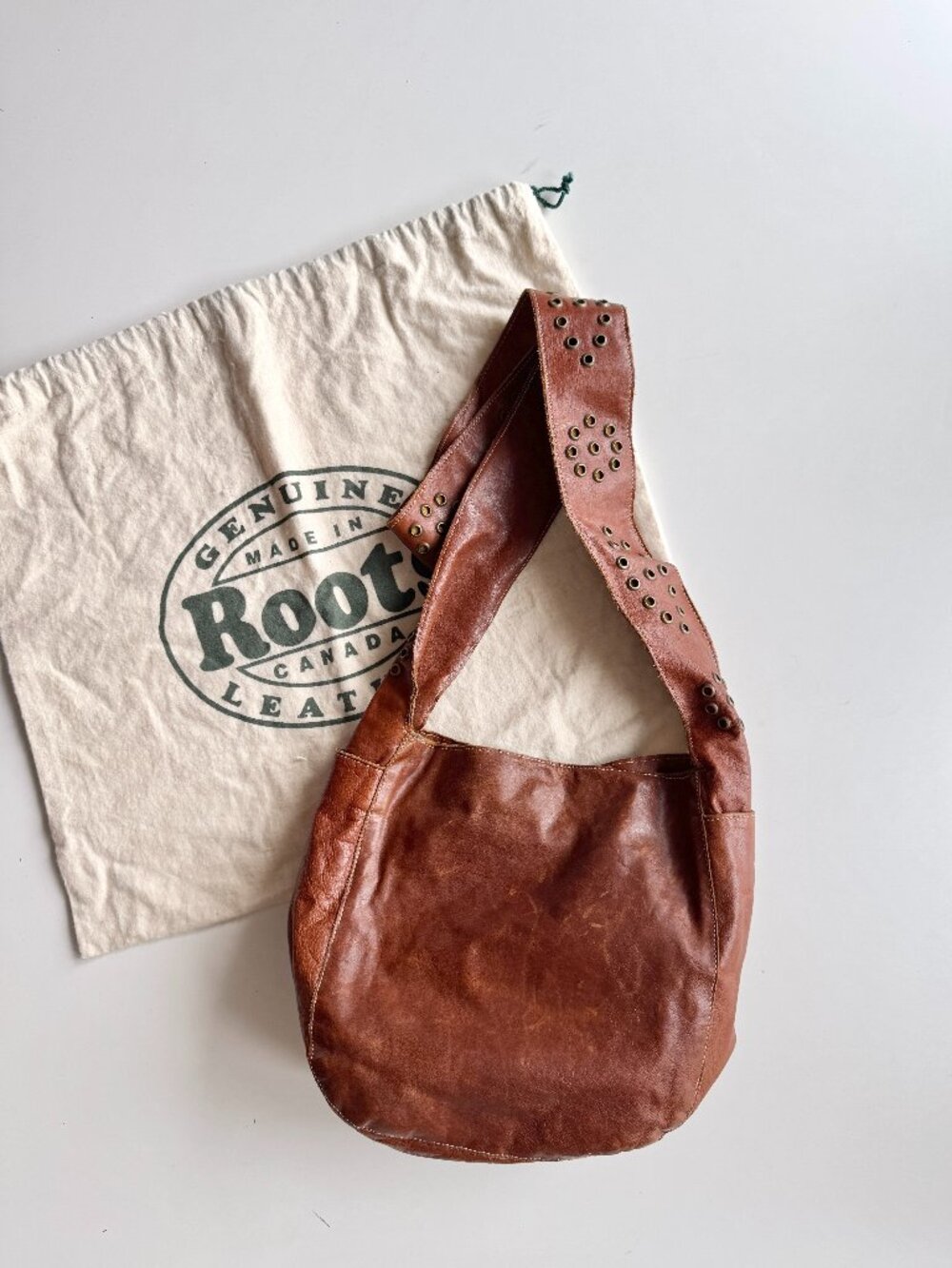 Vintage ROOTS Brown Leather Grommet Strap Small Crossbody Hobo Bag